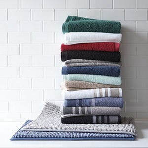 Home Expressions Solid and Stripe Bath Towel Collection for $2.99 each